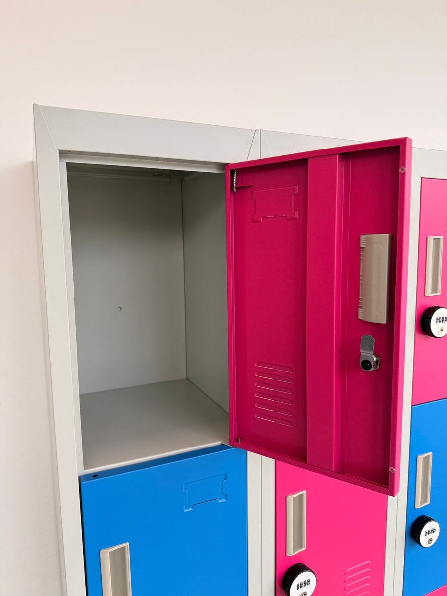 An open pink locker door with its four digit combination lock and name label holder